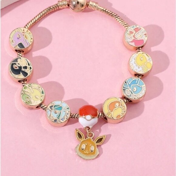 ⭐️NEW⭐️ Gold Plated & Enameled Pokémon Eevee Eeveelution Themed Charm Bracelet - Picture 2 of 8